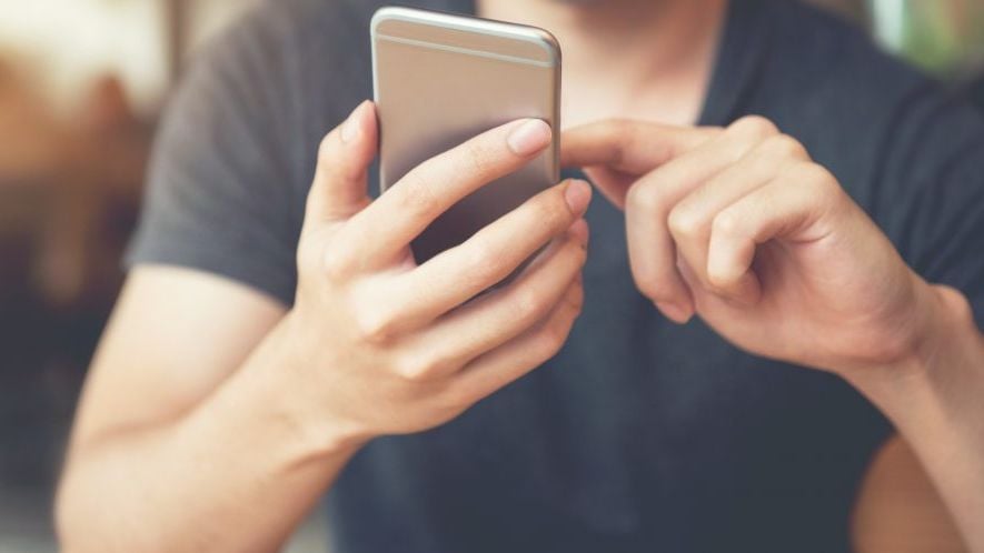 Close view of man holding his mobile