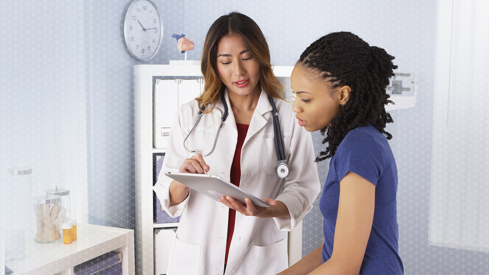 Doctor is discussing with patient with smile