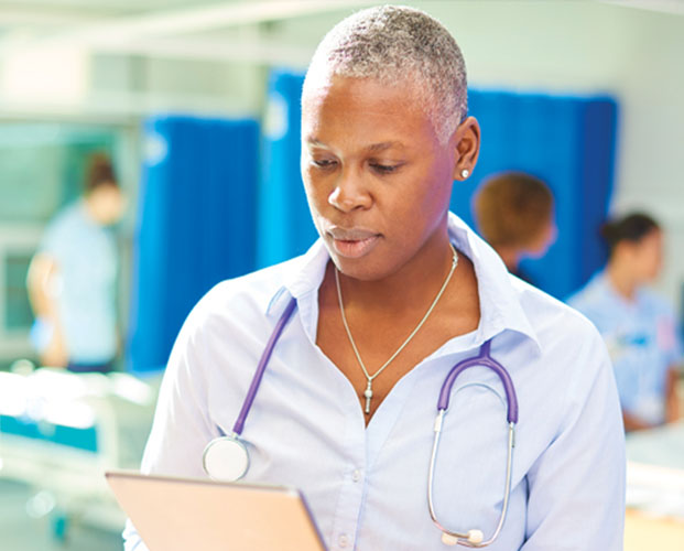 Health worker looking in tablet