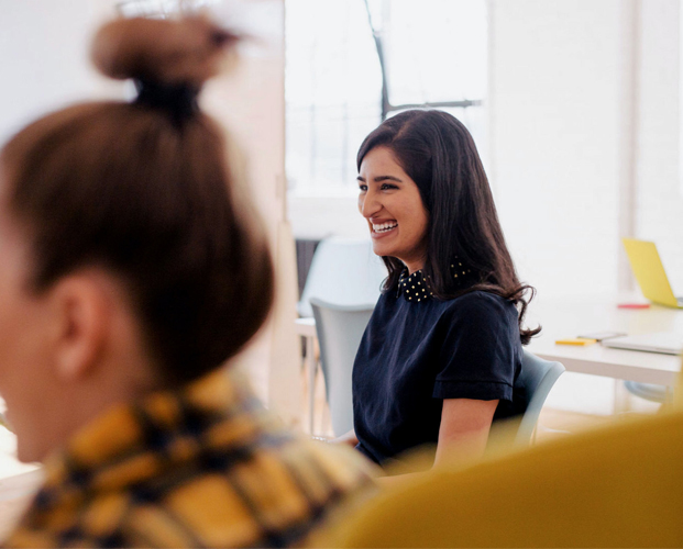 Smiling young woman in the conference room