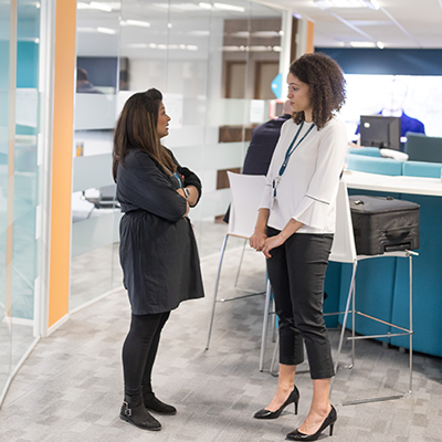 Two young women discussing