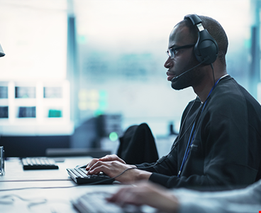 African American Computer Engineer Finds and Fixes Bugs banner