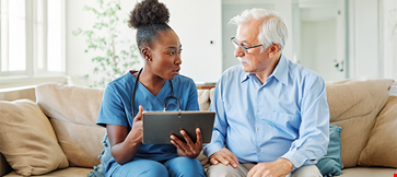 Doctor nurse caregiver showing tablet screen