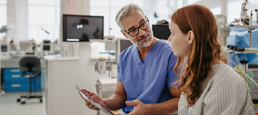 Doctor showing teenage patient mri scan