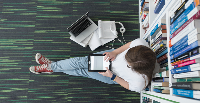 Female student study library using tablet