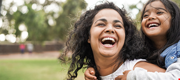 Happy indian mother having fun her daughter