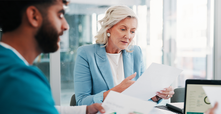 Meeting and people with paperwork for finance report