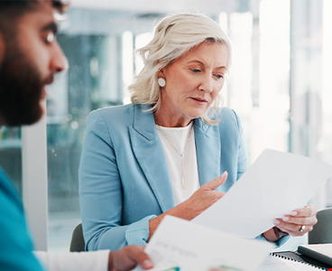 Meeting and people with paperwork for finance report