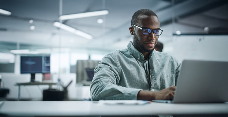 modern-office-portrait-motivated-black-programmer