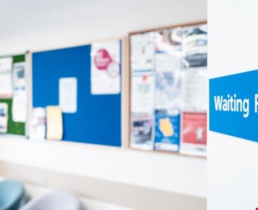 NHS hospital waiting room sign 