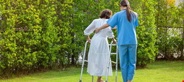 Nurse takes care elderly woman while