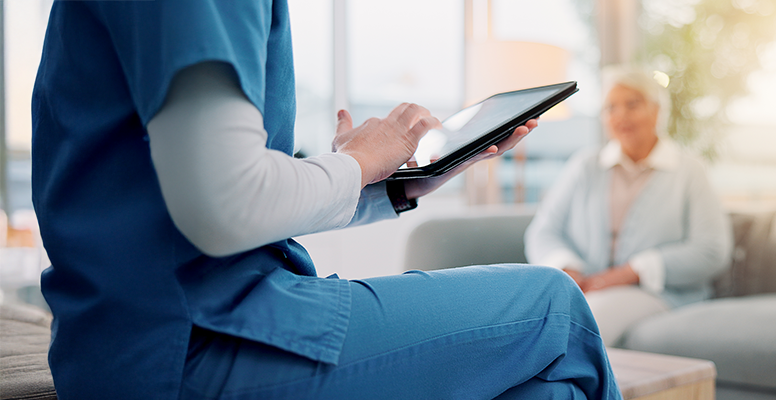 Nurse typing for counseling and checking details on tablet