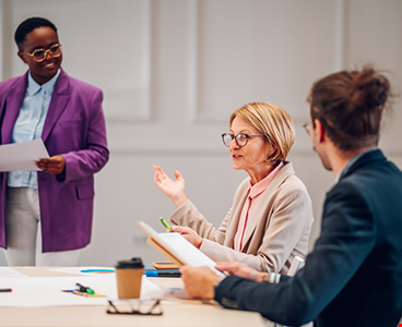 Office people group talking during staff meeting