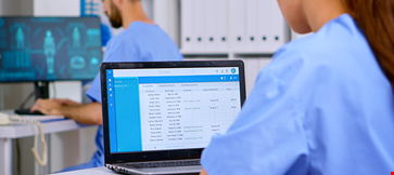 Professional doctor assistant checking medical records