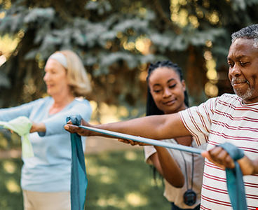 Senior using resistance band during physical therapy