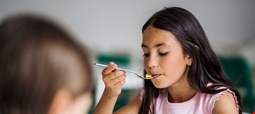 small-school-girlas-canteen-eating-lunch