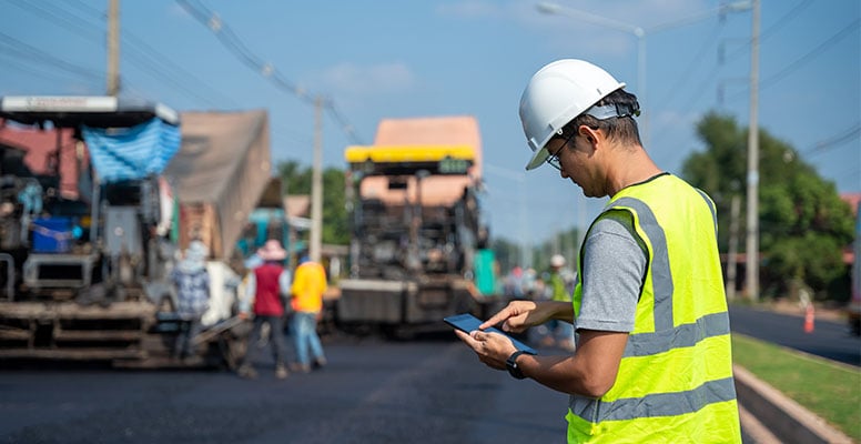 The engineer in a helmet & Helmet working on road work