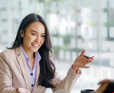 Two beautiful young businesswoman conversation
