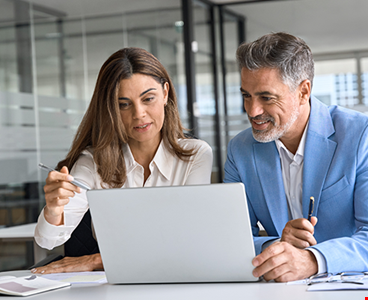 Two busy happy middle aged professional