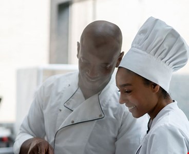 Two catering worker discussing