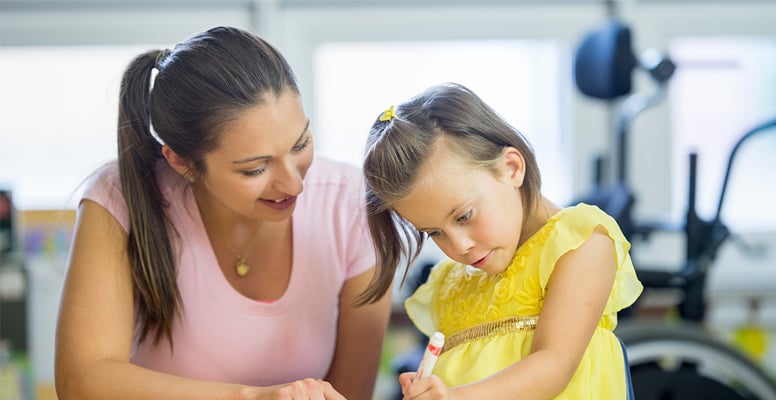 woman teaching her girl child