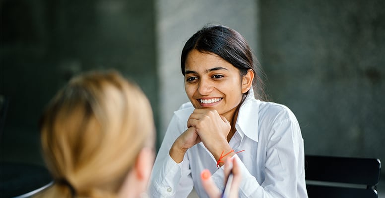 Young attractive indian asian woman interviewing