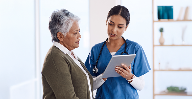 Young doctor using a digital tablet during a consultation