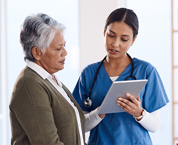 Young doctor using a digital tablet during a consultation
