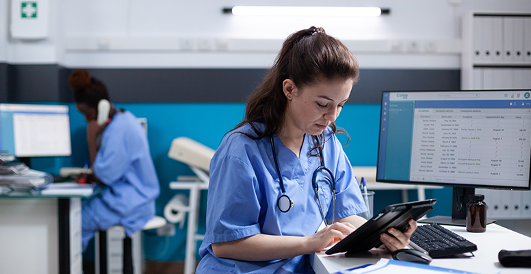 Young nurse checking appointments list