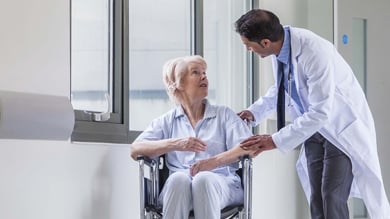 Doctor discussing with old lady