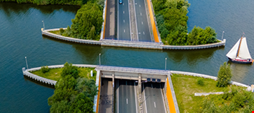 A road stretches across a canal