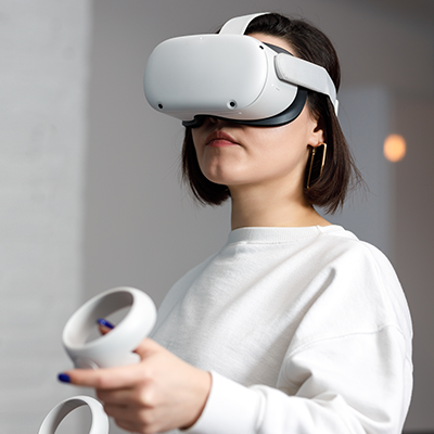 Young woman testing VR glasses