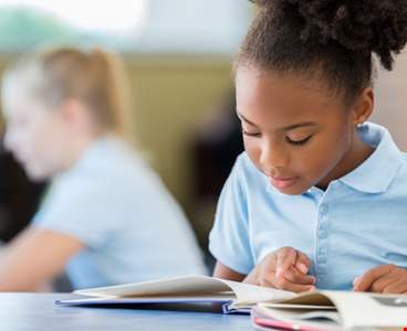 School girl reading