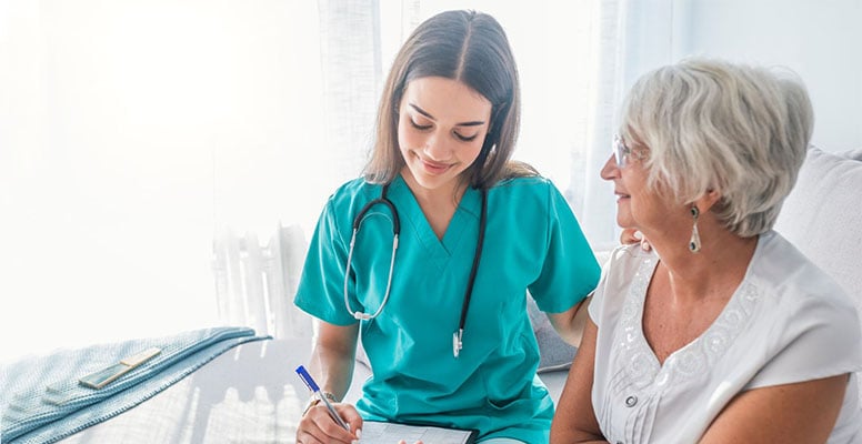 Nurse measuring blood pressure of a senior citizen lady