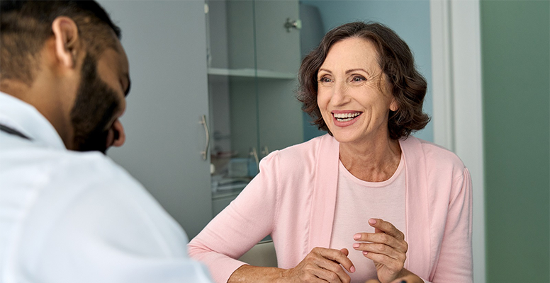A woman laughing and discussing with a guy