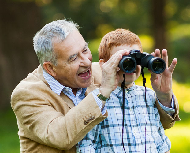 grandfather-grandson-watching-nature-binoculars-park