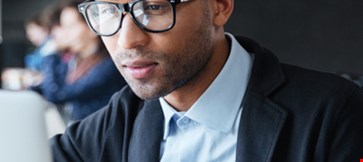 young businessman working with laptop in the office