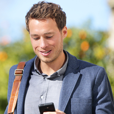 Young urban businessman professional on smartphone